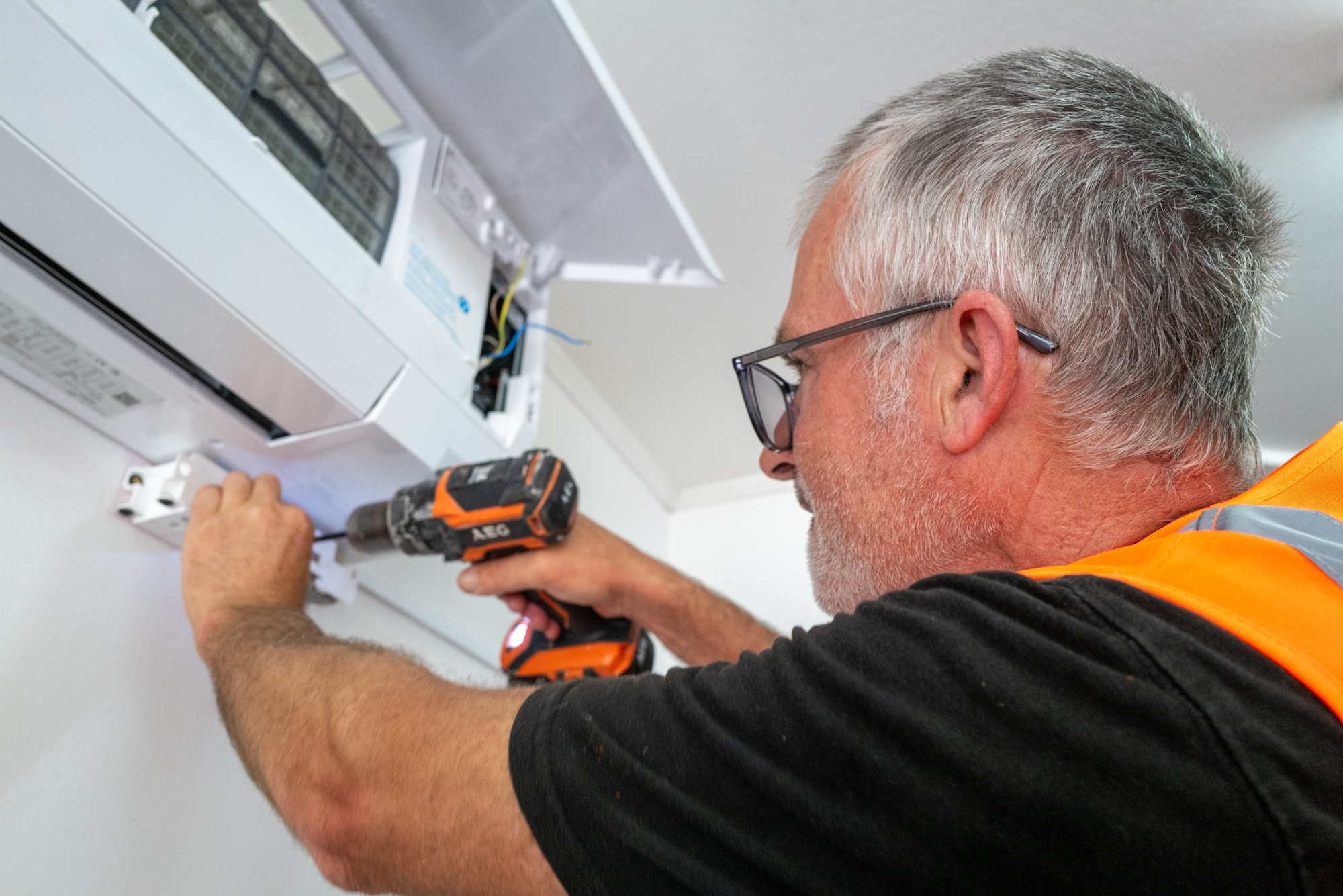 Carl installing a heat pump